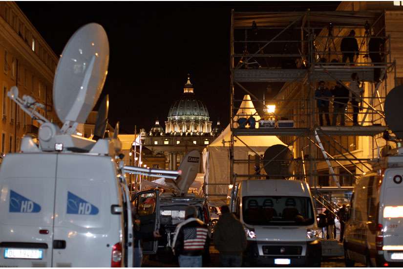 Satellite trucks and a riser for television journalists are seen at the foot of Via della Conciliazione, the road leading to the Vatican. Almost everything we do depends on something in space and Project Ploughshares says it will continue to be on the frontlines in the fight against the weaponization of space.