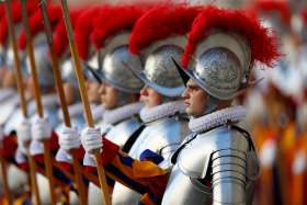  New Swiss Guard members stand at attention during their swearing-in ceremony at the Vatican May 6, 2021.