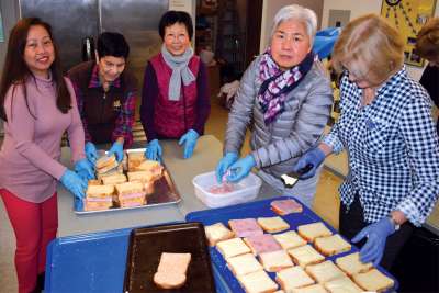 Society of St. Vincent de Paul volunteers prepare sandwiches for the needy. Society members didn’t let the pandemic slow down efforts to look after those in need in society.