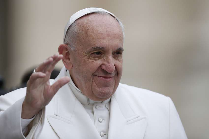 Pope Francis waves as he arrives for his general audience in St. Peter&#039;s Square at the Vatican Feb. 22.