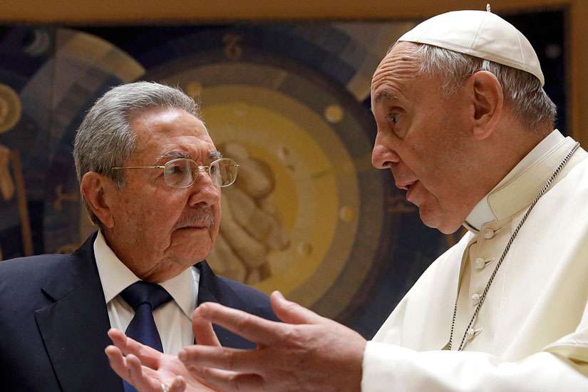 Pope Francis talks with Cuban President Raul Castro during a private audience at the Vatican May 10.