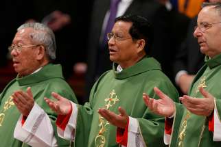 Newly appointed Cardinals pray the Our Father during Mass in 2015. 