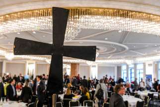 A cross is displayed during a meeting of the Central Committee of German Catholics in Bonn Nov. 22, 2019. Catholic leaders in Germany have compiled responses from lay Catholics in areas related to who holds power in the church, sexual morals, the role of priests and the place of women in church offices in preparation for an upcoming synodal assembly to debate church reforms.