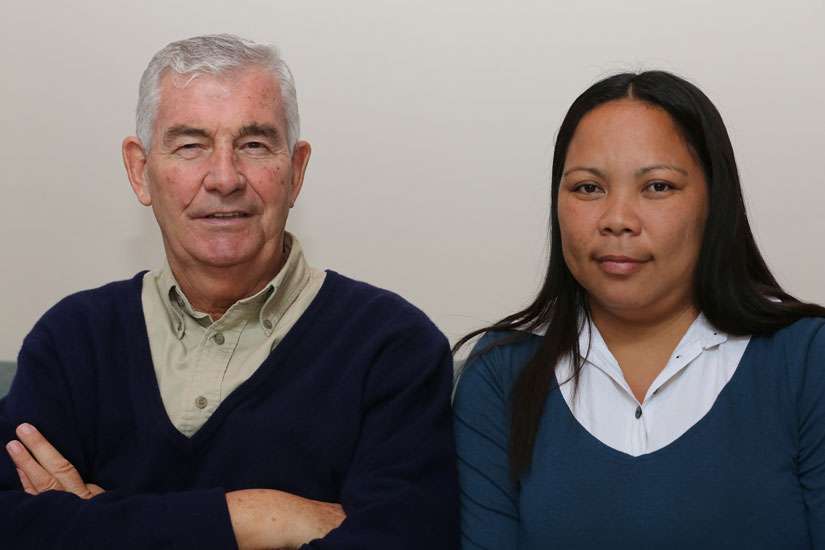 Columban Father Shay Cullen, founder and president of the PREDA Foundation, and Marlyn Capio-Richter, paralegal officer and social worker with the foundation and a survivor of sex trafficking, pose for a photo April 20 in Washington. The foundation works with children and young women rescued from human trafficking situations.