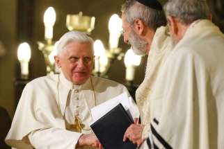Pope Benedict XVI greets Rabbi Riccardo Di Segni, the chief rabbi of Rome, during his visit to the main synagogue in Rome in this 2010 file photo. The now retired pontiff sent a letter correcting a German theologian who implied that Pope Benedict encouraged the evangelization of the Jewish people as a mission.