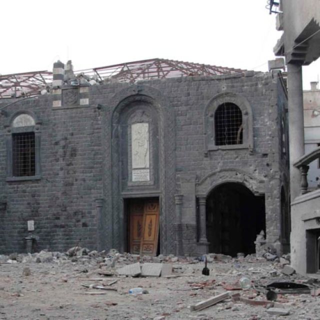 A damaged church is seen after fighting in the old city of Homs, Syria, Sept. 23. The Vatican announced Oct. 16 that a papal delegation, including Cardinal Timothy M. Dolan of New York, would visit Syria the following week, to show solidarity with people suffering from the country&#039;s civil war.