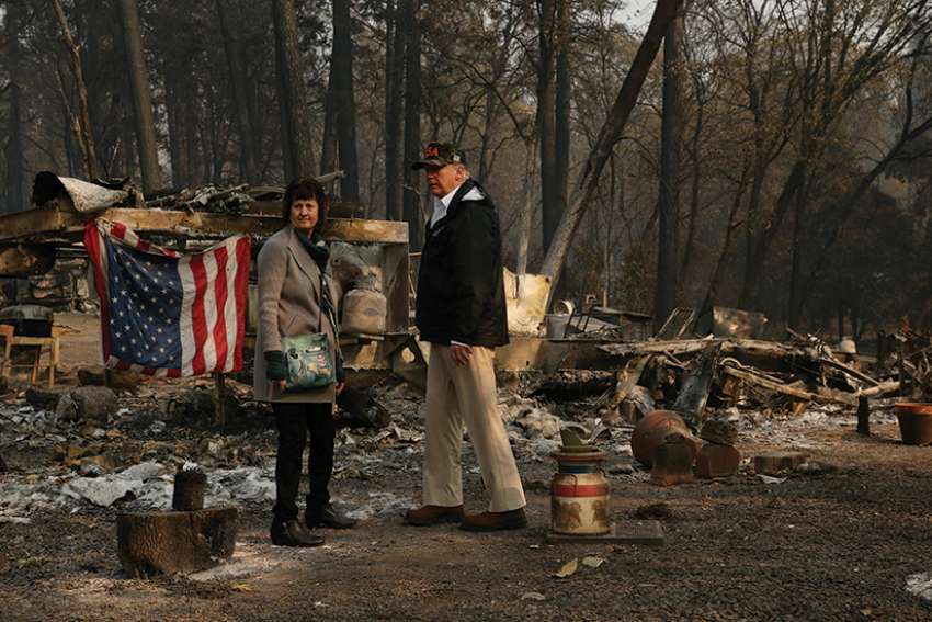 U.S. President Donald Trump and Mayor Jody Jones visit the Skyway Villa Mobile Home and RV Park, a neighborhood destroyed by the Camp Fire, in Paradise, Calif., Nov. 17. Francis at his Sunday Angelus Nov. 18 prayed for the victims of the California wildfires. 