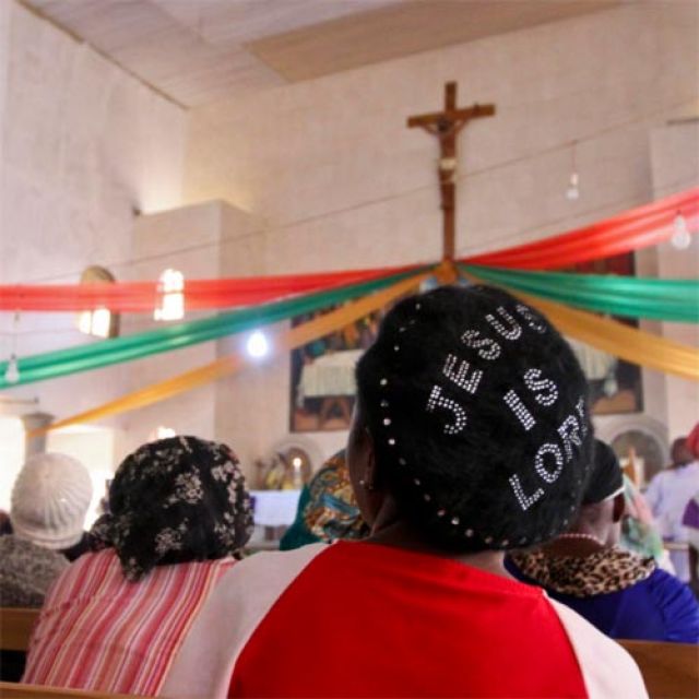 People attend a memorial service in late December at St. Theresa&#039;s Church in Madalla, Nigeria, for victims of a suicide bomb attack on the outskirts of Nigeria&#039;s capital, Abuja. Nigerian President Goodluck Jonathan urged religious leaders to help mold th e characters of their followers to help stop the current crises facing the country.