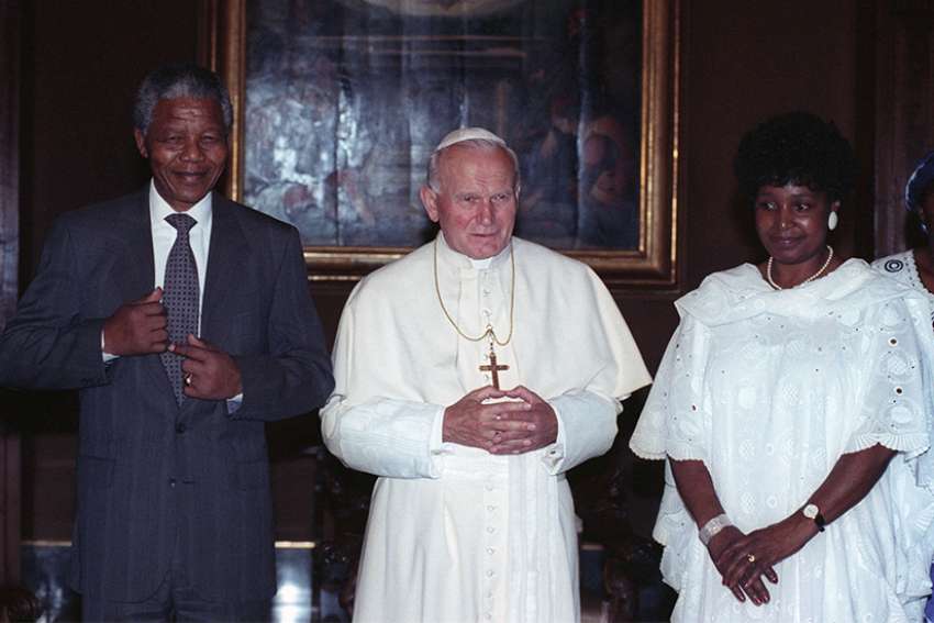 St. John Paul II poses with Nelson Mandela and his wife, Winnie Madikizela-Mandela, in 1990 at the Vatican. The April 14 funeral service for Madikizela-Mandela, who died April 2 at age 81, was attended by tens of thousands of people and was followed by a burial ceremony at a memorial park north of Johannesburg.
