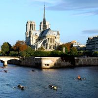 Rowers pass Notre Dame Cathedral in Paris. A recent European trip by Herman Goodden found the historic cathedral packed with camera-wielding tourists