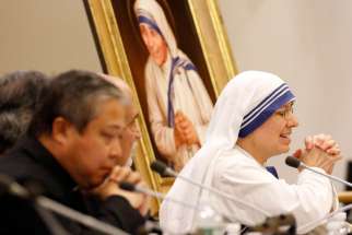 Sister Clare Roy, a member of the Missionaries of Charity, closes her eyes and clasps her hands as she speaks during a conference at the United Nations Sept. 9 on St. Teresa of Calcutta&#039;s enduring message to the international community.