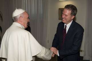 Pope Francis greets Greg Burke, the new director of the Vatican press office, at the Vatican July 11. Burke, a native of St. Louis, has worked for the Vatican since 2012 and prior to that was a television correspondent for Fox News and a correspondent for Time magazine.