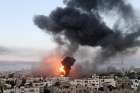  Smoke and flames rise during Israeli airstrikes on Gaza May 12, 2021.