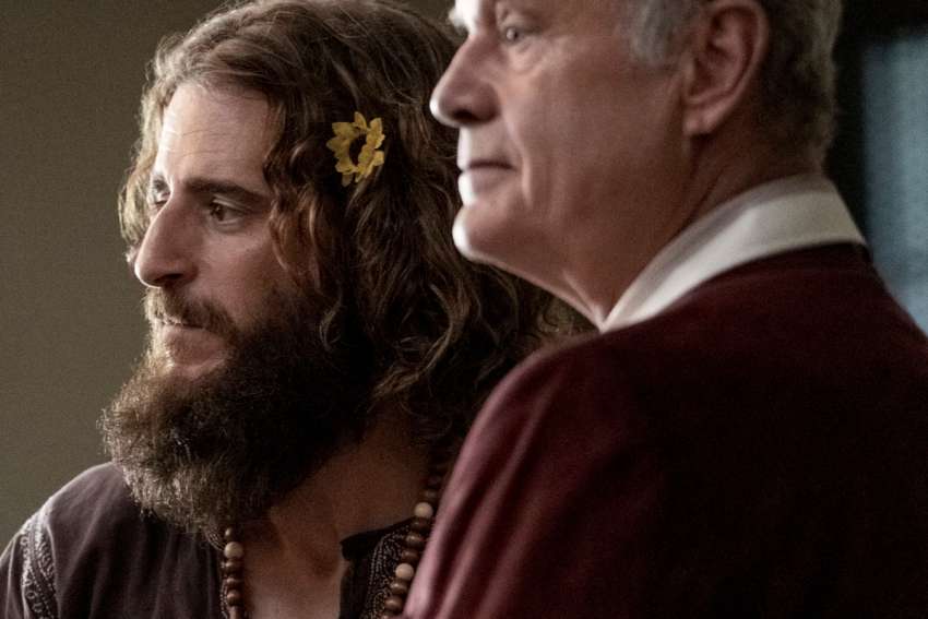 Jonathan Roumie and Kelsey Grammer star in a scene from the movie Jesus Revolution. What the film lacks in theological soundness it makes up for by refraining from Hollywood’s usual “objectionable ingredients” when dealing with faith.