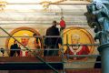 Workers install a mosaic depicting Pope Francis next to the one depicting Pope Benedict XVI in St. Paul’s Basilica in Rome Dec. 9.
