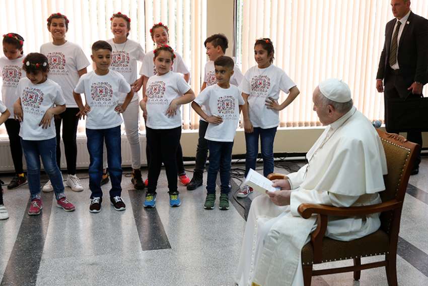 Children perform as Pope Francis visits with refugees in Sofia, Bulgaria, May 6, 2019. 
