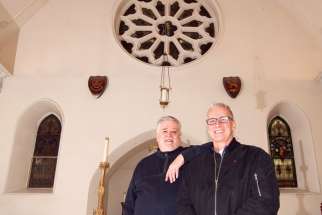 Fr. Michael Busch, rector of St. Michael’s Cathedral, at left, with Marc Ferguson of Buttcon Ltd., the lead contractor on the renovations the cathedral is undergoing.
