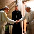 Pope Francis shakes hands with retired Pope Benedict XVI during a visit to the Mater Ecclesiae monastery at the Vatican Dec. 23. The monastery, located in the Vatican Gardens to the north of St. Peter&#039;s Basilica, is where the retired pope is living.