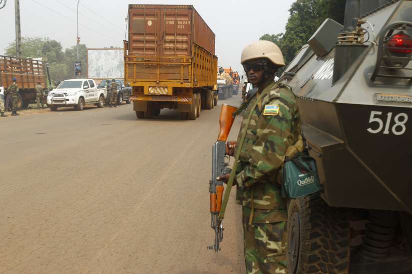 Peacekeeping troops escort a humanitarian aid convoy in mid-February in Bangui, Central African Republic. Catholic Church leaders and Kenyan officials say that security is a top concern for Pope Francis’ Nov. 25-30 African visit.