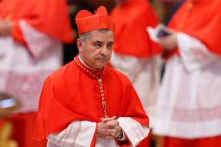 Cardinal Angelo Becciu, prefect of the Congregation for Saints&#039; Causes, is pictured after being made a cardinal by Pope Francis during a consistory in St. Peter&#039;s Basilica at the Vatican June 2018.