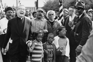 Clergy joined the famous Selma to Montgomery march in 1965, a key moment in the history of the civil rights movement  in the U.S. The march featured Martin Luther King Jr. and his wife Coretta (centre), as well as movement co-founder Ralph Abernathy and his children, who joined hands with the unidentified clergyman.