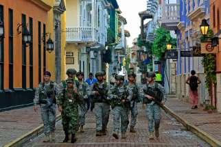  Colombian soldiers patrol Cartagena prior to the signing of a peace deal between the government and the Revolutionary Armed Forces of Colombia guerrillas Sept. 26.