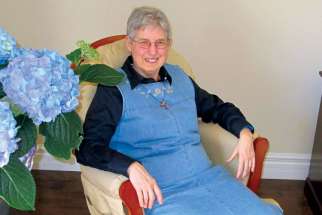 Sr. Linda Dube sits in the living room of the soon-to-open Our Lady of Guadalupe Home for Mothers.