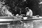 Father Karol Wojtyla, the future Pope John Paul II, is pictured reading in a kayak in this photo dated 1955. Less than six months after St. John Paul II was canonized, questions are being raised about a book of lectures he penned on social ethics as a yo ung priest in his Polish homeland.