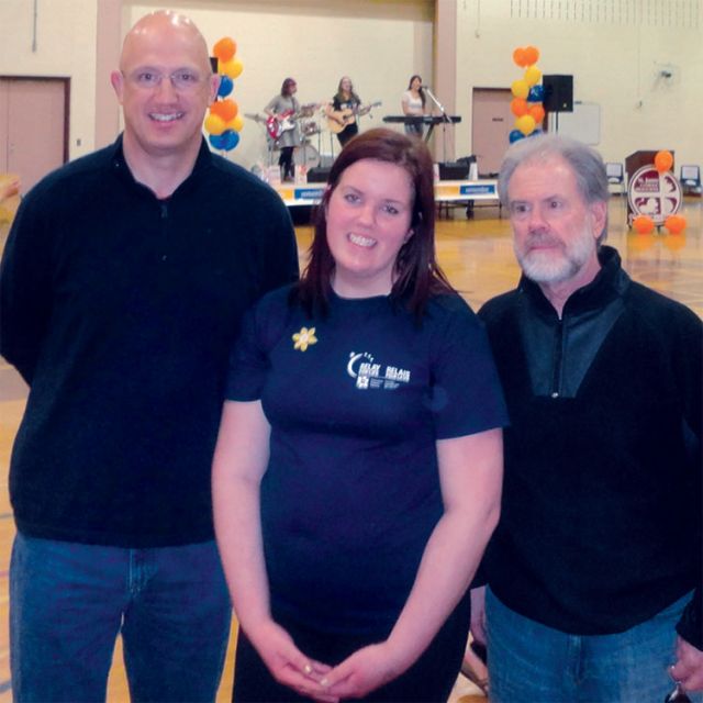 Principal Timothy Yawney (left), relay committee Chair Brianna Porier, Wellington CDSB Director of Education Don Drone at the third annual St. James Catholic High School Relay for Life in Guelph, Ont.