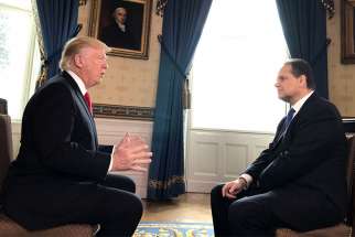 Christian Broadcasting Network chief political correspondent David Brody, right, interviews President Trump at the White House.