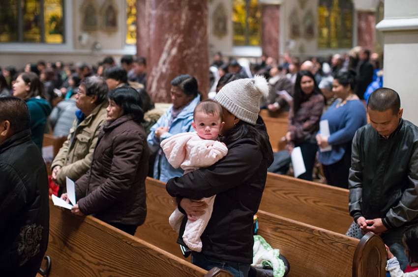 Parishioners attend Mass at Holy Rosary Cathedral in Vancouver, B.C. Dec. 15, 2016. New census data says that couples without children is growing faster than couples with children.