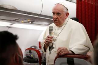 Pope Francis answers questions from journalists aboard his flight from Malta to Rome April 3, 2022.