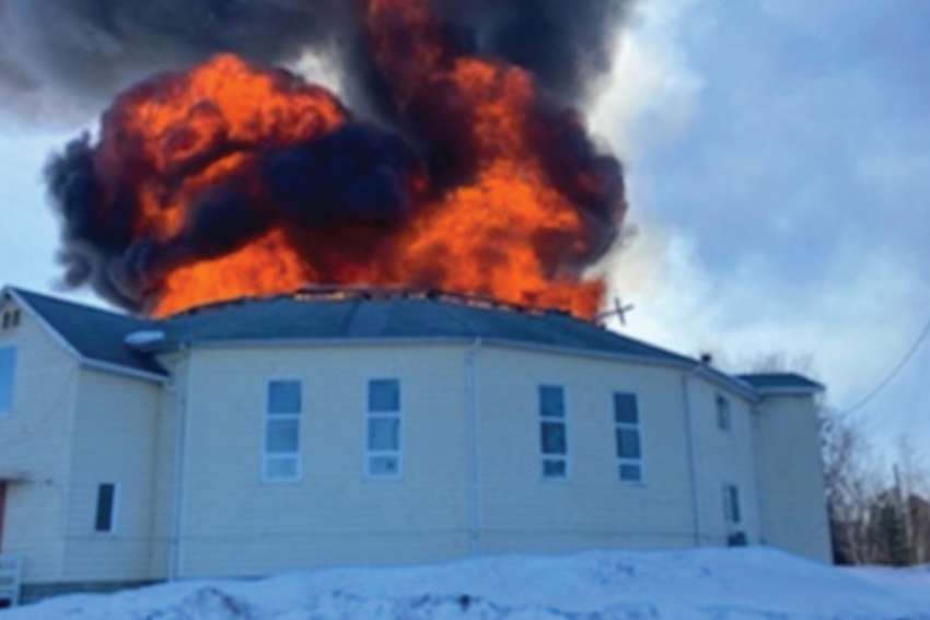 Flames shoot through the roof of the Catholic Church on St. Theresa Point First Nation on Easter Sunday.