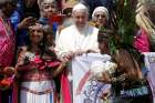 Pope Francis poses with members of the Assembly of Indigenous Peoples after his general audience in St. Peter&#039;s Square at the Vatican.
