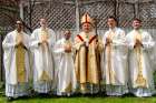 Following the May 10 ordination at St. Michael&#039;s Cathedral Fr. Neiman D&#039;Souza, Fr. Scott Birchall, Fr. Michael Simeos, Cardinal Thomas Collins,  Fr. Marijan Šiško and Fr. Omar Hernandez (left to right), gather in the rector&#039;s backyard. 