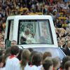 Pope Benedict XVI waves to the crowd as he arrives in his popemobile to celebrate Mass at Berlin&#039;s Olympic Stadium Sept. 22.