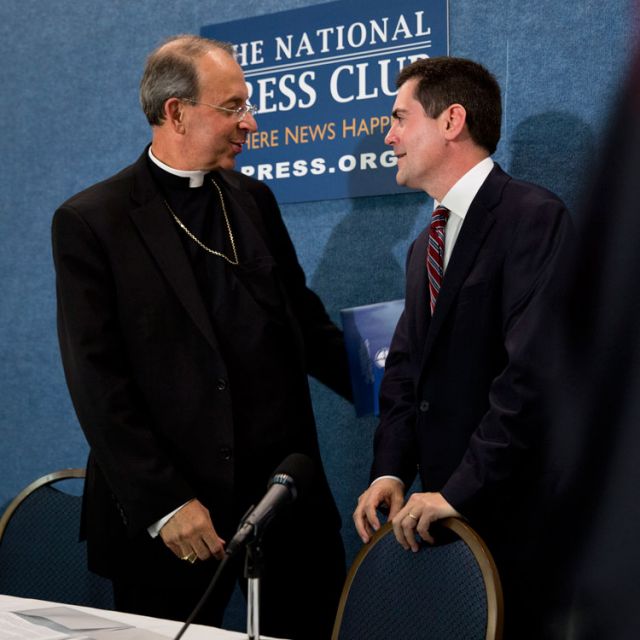 Archbishop William E. Lori of Baltimore, chairman of the U.S. bishops&#039; Ad Hoc Committee for Religious Liberty, talks with Russell D. Moore, president of the Southern Baptist Convention&#039;s Ethics &amp; Religious Liberty Commission, during a news conference at the National Press Club in Washington July 2. The two are part of a diverse group of religious leaders urging the U.S. government to &quot;expand conscience protections&quot; in its Health and Human Services mandate that requires almost all employers to provide c overage of contraceptives, sterilization and some abortion-inducing drugs free of charge.