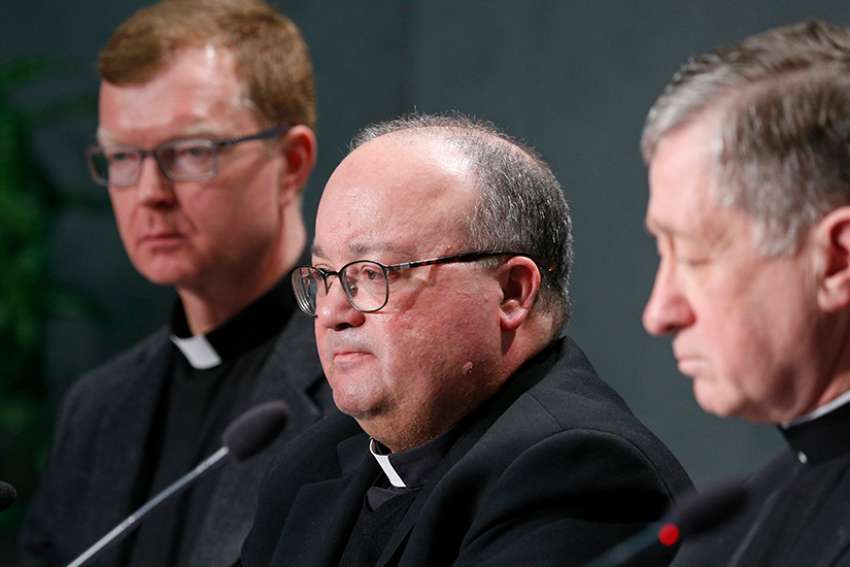 esuit Father Hans Zollner, Archbishop Charles J. Scicluna of Malta and Cardinal Blase J. Cupich of Chicago, all members of the organizing committee for the Feb. 21-24 Vatican meeting on the protection of minors in the church, attend a press conference to preview the meeting at the Vatican Feb. 18, 2019.