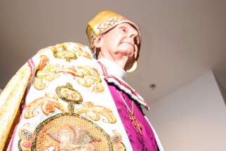 Retired Anglican Archbishop of Toronto Terrence Finlay models Bishop Charles Henry Brent’s Cope, given to him in 1920 by the people of France for his service with the American Expeditionary Forces during the last year of the First World War. The elaborate liturgical garment has been restored by the Needleworkers Guild of Toronto. 