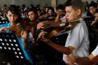 Members of the youth symphony orchestra rehearse at PolÃ­gono Industrial Don Bosco, located in a crime-ridden area of San Salvador, El Salvador.