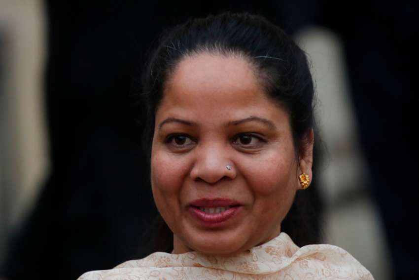 Asia Bibi, a Pakistani Catholic woman acquitted of blasphemy after spending eight years on death row in Pakistan, leaves after a meeting at the Elysee Palace in Paris in this Feb. 28, 2020, file photo. Bibi has appealed for the protection of victims of blasphemy laws in her home country. She also said her family is struggling in Canada, because the government only supported them for one year.