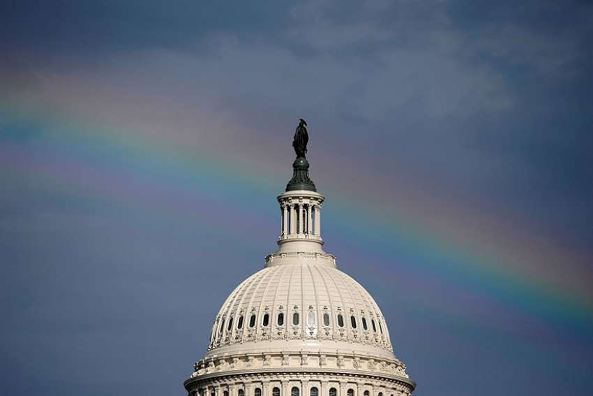 A rainbow shines over the U.S. Capitol in Washington July 24. U.S. Senate voted 51-50 to proceed with health care debate July 25.