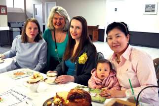 Brenda Ezman, left, is hoping to spearhead a mothers’ group at St. Vincent de Paul Roman Catholic Church in Toronto with Liz Santoro, middle, and Liz Nicassio, right. Dorothy Pilarski, second from the left, is leading the archdiocese-wide effort to create more mothers’ groups. 