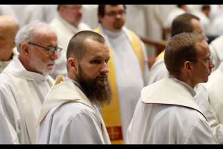 Capuchin friars attend an early morning Mass with Pope Francis in St. Peter&#039;s Basilica at the Vatican Feb. 9. 
