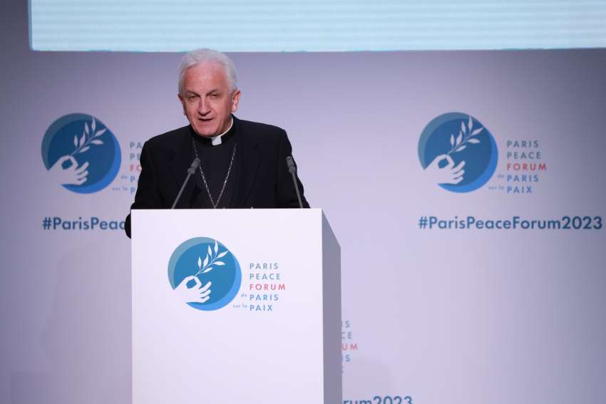 Archbishop Celestino Migliore, the apostolic nuncio to France, reads a message from Pope Francis at the opening of the Paris Peace Forum Nov. 10, 2023, in the Palais Brongniart in Paris.