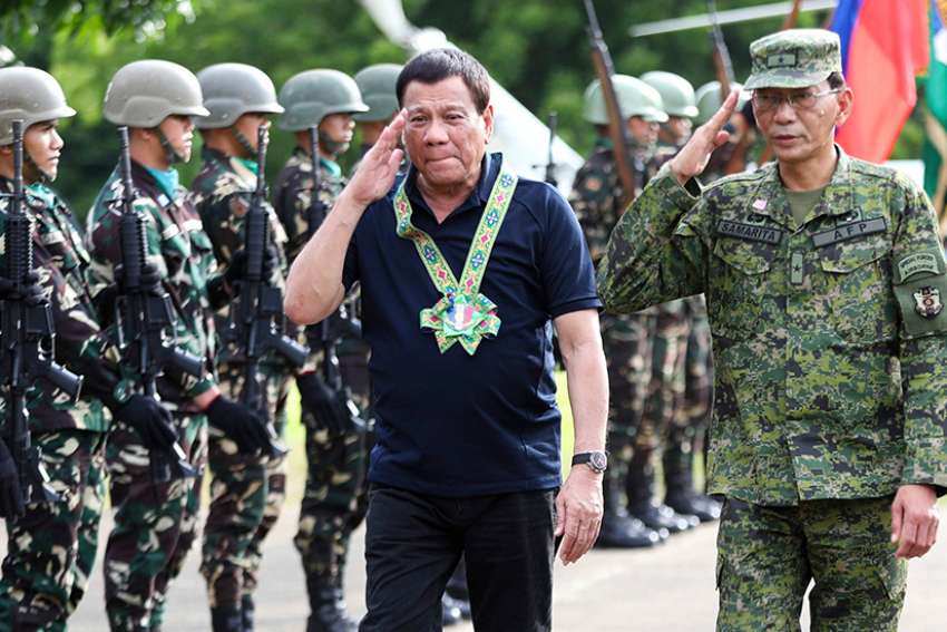 Philippine President Rodrigo Duterte is seen with the military in Carmen, Philippines, June 6. Duterte imposed martial law to combat gunmen claiming to have links with the Islamic State.