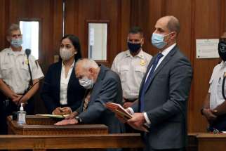 Former Cardinal Theodore E. McCarrick wears a mask during arraignment at Dedham District Court in Dedham, Mass., Sept. 3, 2021, after being charged with molesting a 16-year-old boy during a 1974 wedding reception. A medical expert consulted by Massachusetts prosecutors says McCarrick is not competent to stand trial.