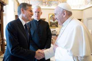 Pope Francis shakes hands with U.S. Secretary of State Antony Blinken during an audience at the Vatican June 28, 2021.