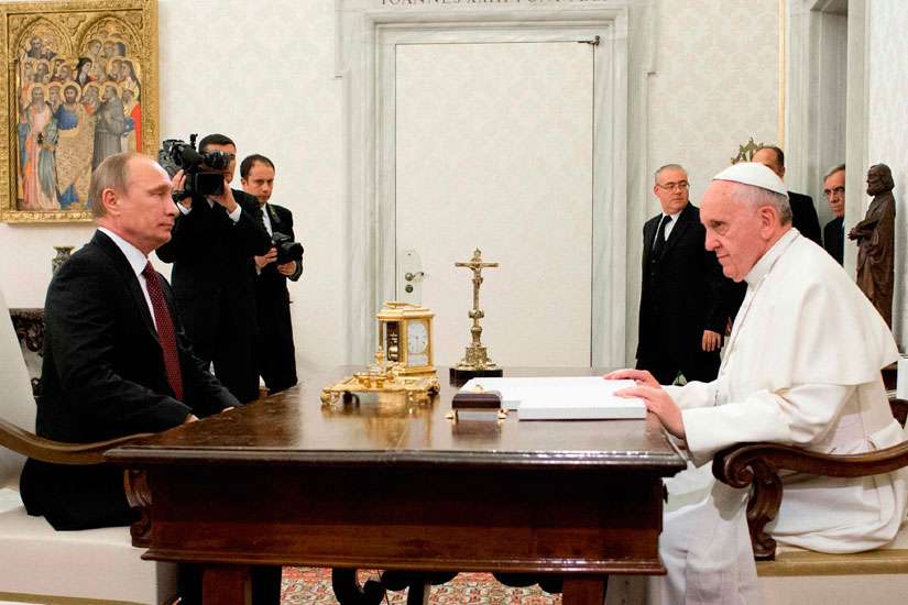 Pope Francis meets with Russian President Vladimir Putin during a private audience at the Vatican Nov. 25, 2013.