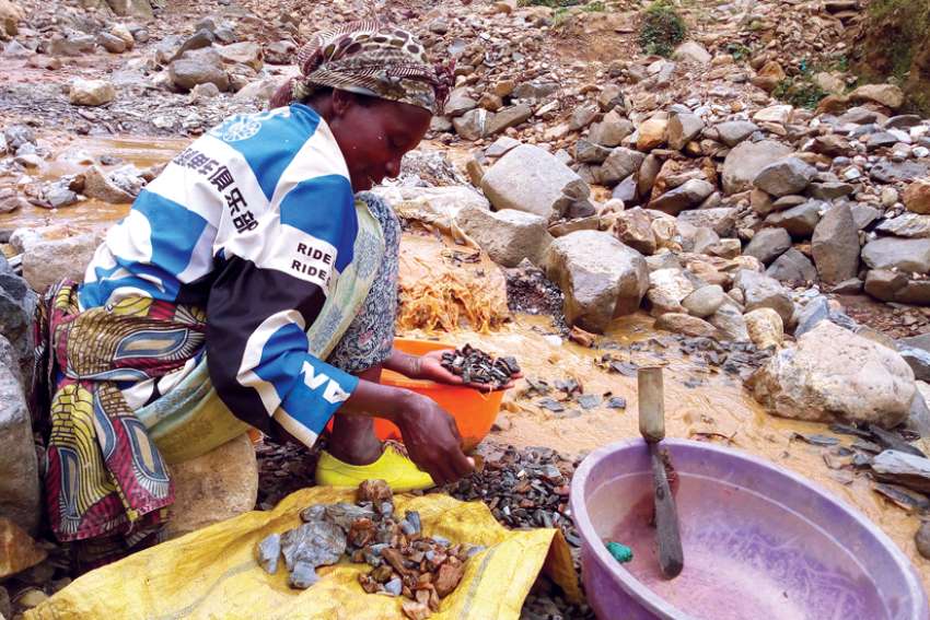 A miner works at an artisanal gold mine near Kamituga, Congo, Aug. 1, 2018.